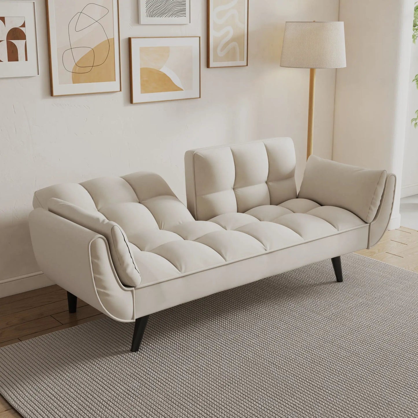 Soft beige futon sofa with two armrests in a cozy living space by Unique Piece Furniture on Tampa Home & Garden Store