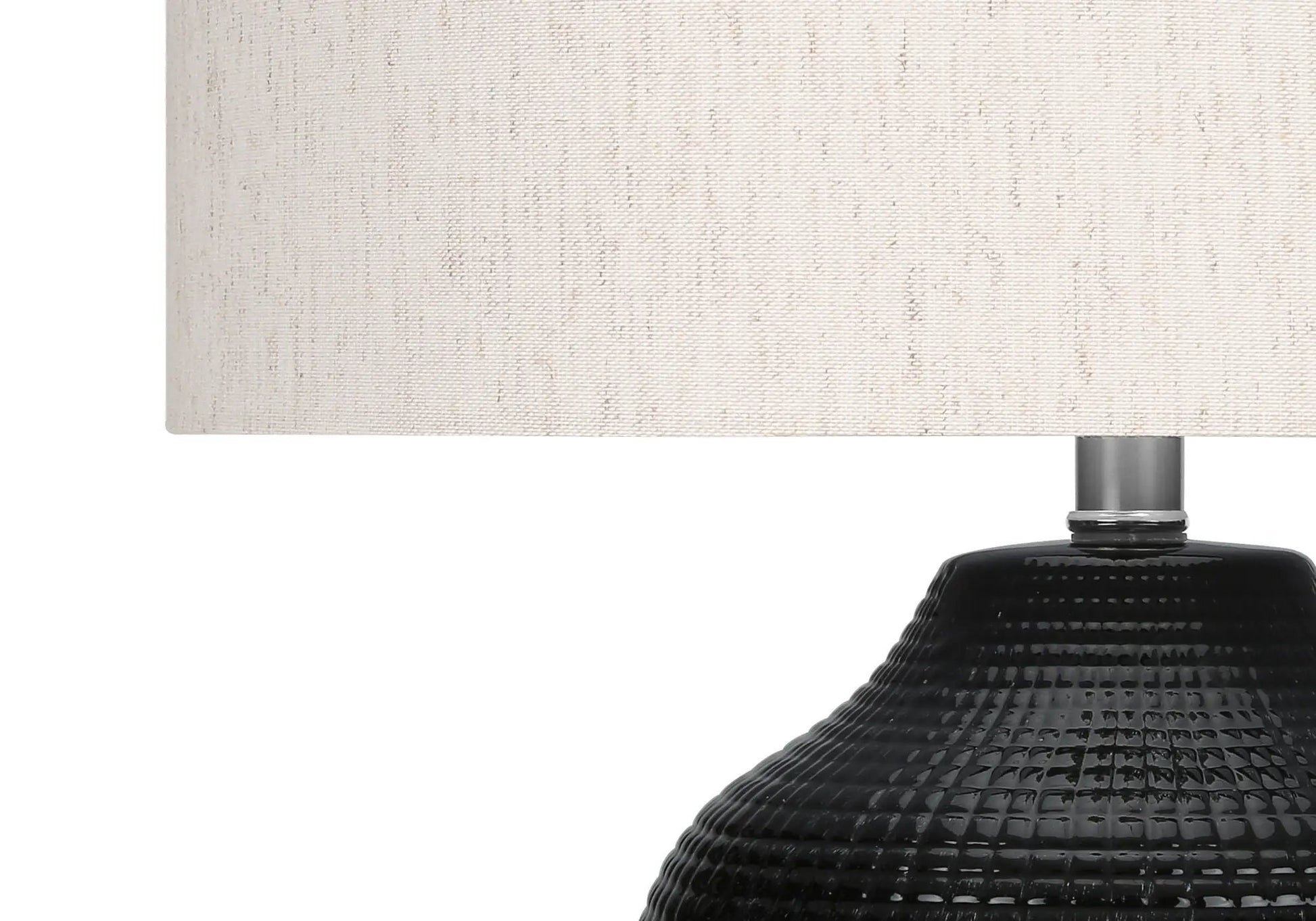 Table lamp with cream fabric shade and black textured ceramic base on Tampa Home & Garden Store