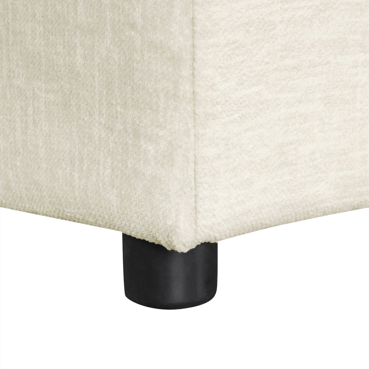 Twin size folding sleeper ottoman in cream upholstery with black cylindrical leg on Tampa Home & Garden Store