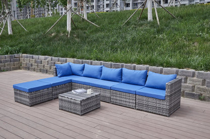 Patio sofa with blue cushions in a wicker 2-piece outdoor set by Unique Piece Furniture on Tampa Home & Garden Store