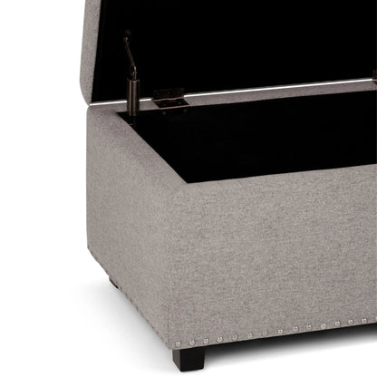 Hamilton upholstered storage ottoman by Unique Piece Furniture, grey fabric with nailhead trim on Tampa Home & Garden Store