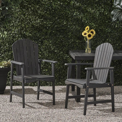 Dark gray acacia wood Adirondack dining chairs (set of 2) beside a table with sunflowers on Tampa Home & Garden Store