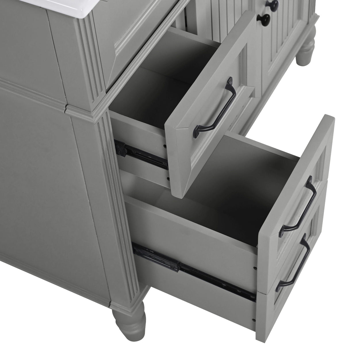 Bathroom vanity with sink, freestanding solid wood cabinet in gray finish with open drawers and black handles on Tampa Home & Garden Store