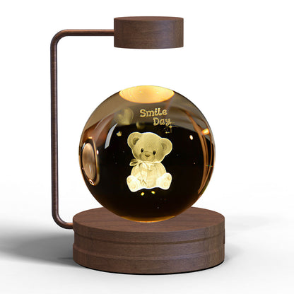 Crystal ball night light with teddy bear engraving, warm amber glow on wooden base USB powered on Tampa Home & Garden Store