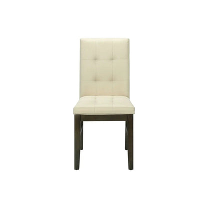 Dining chair upholstered in cream fabric with tall tufted back and dark wood legs on Tampa Home & Garden Store