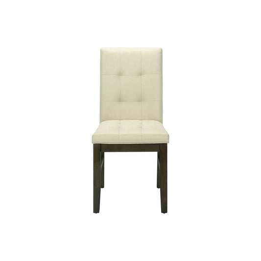 Dining chair upholstered in cream fabric with tall tufted back and dark wood legs on Tampa Home & Garden Store