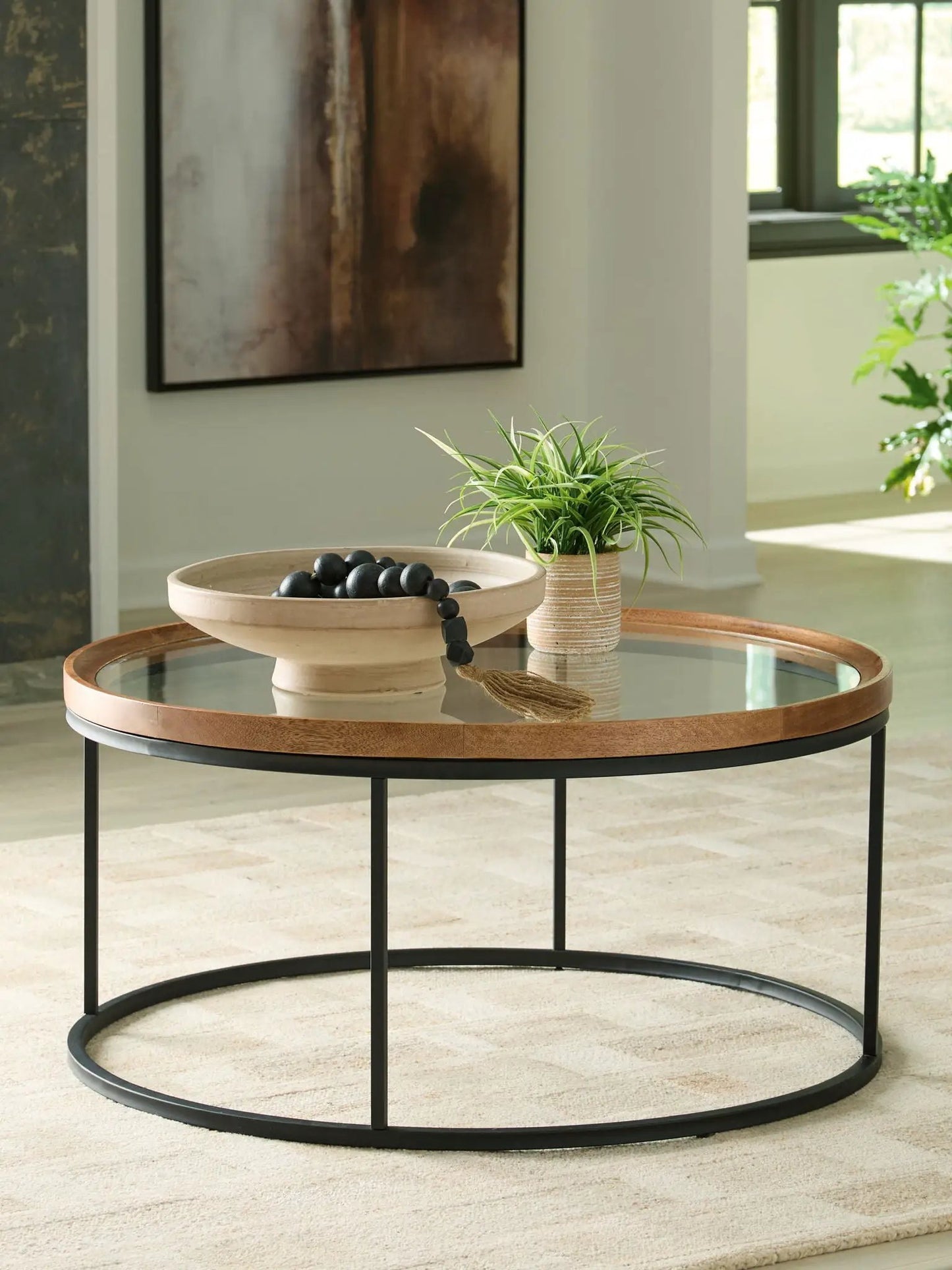 Noraluna round end table by Unique Piece Furniture with glass top, black metal legs on Tampa Home & Garden Store