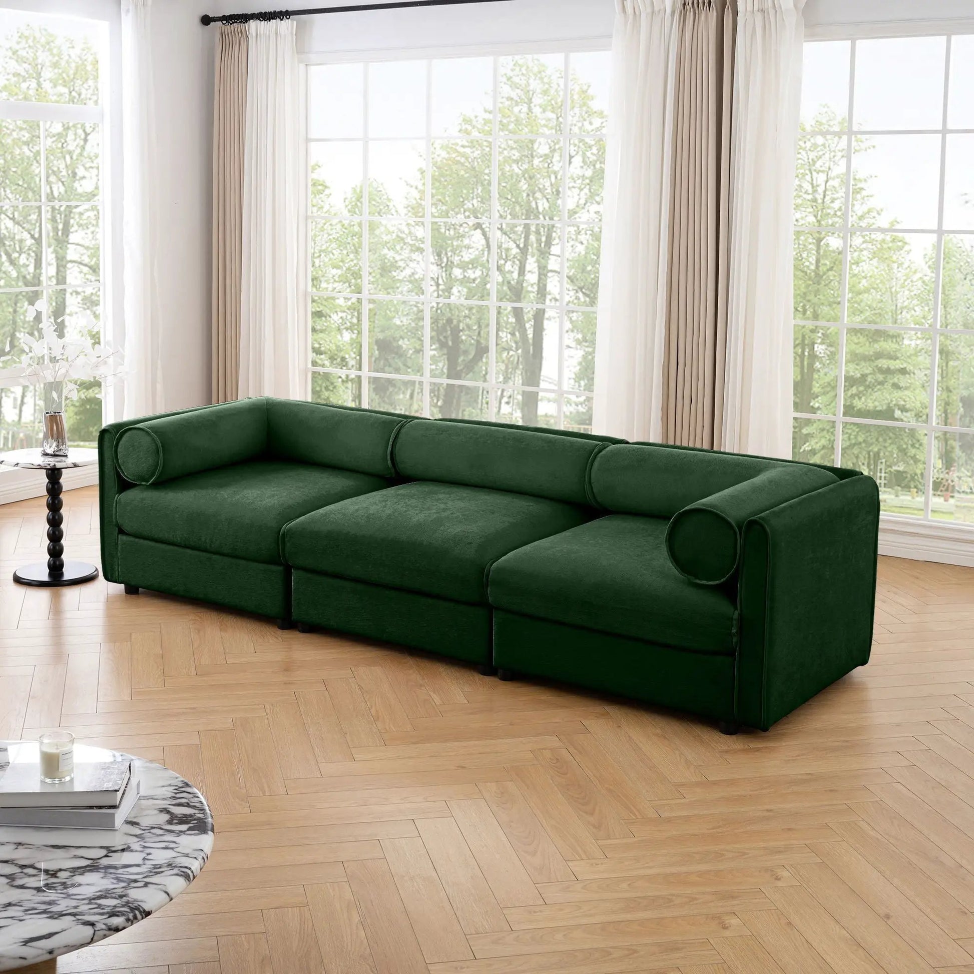 Stationary green velvet sofa with cylindrical bolster arms and hidden storage seat on Tampa Home & Garden Store