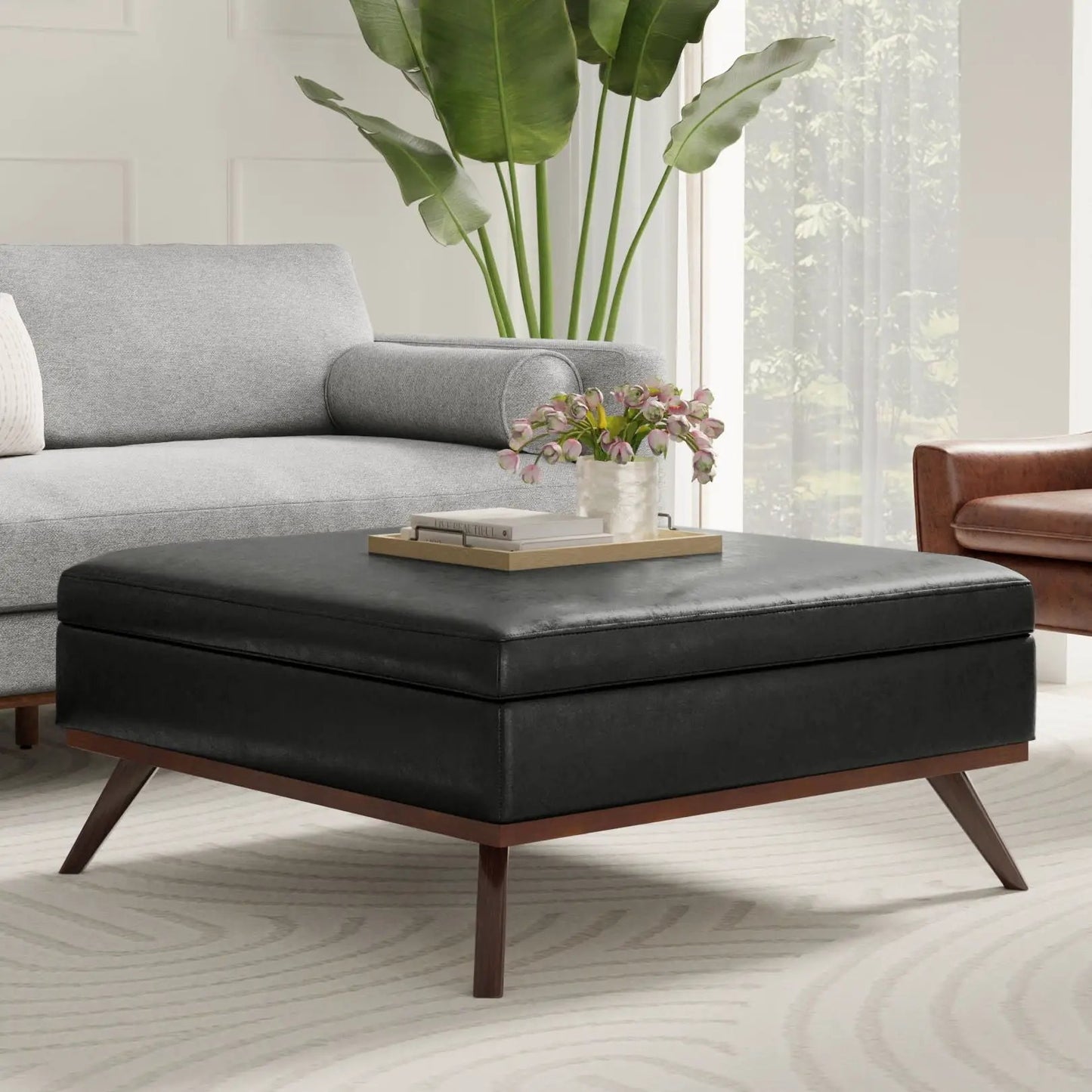 Owen multifunctional square coffee table storage ottoman, black faux-leather top with wooden legs on Tampa Home & Garden Store