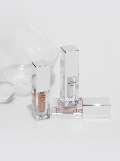Dear.A glitter eyeshadow liquids in 3 clear tubes with silver caps; peach and silver shades on Tampa Home & Garden Store