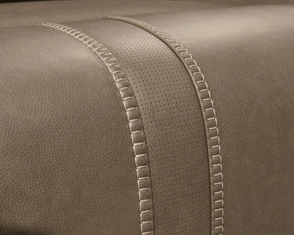 Max-Momentum reclining sectional close-up in taupe leather with perforated panel and stitching on Tampa Home & Garden Store