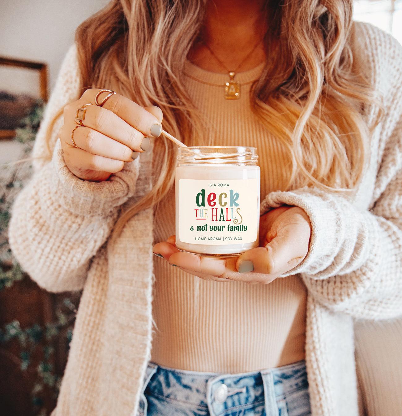 Deck The Halls candle by Gia Roma in a clear glass jar with cream wax and multicolor label on Tampa Home & Garden Store