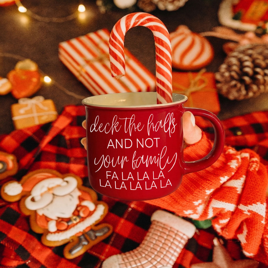 Gia Roma Deck the Halls red ceramic mug with white script, candy cane inside, festive scene on Tampa Home & Garden Store