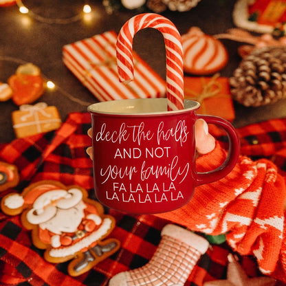 Gia Roma Deck the Halls red ceramic mug with white script, candy cane inside, festive scene on Tampa Home & Garden Store