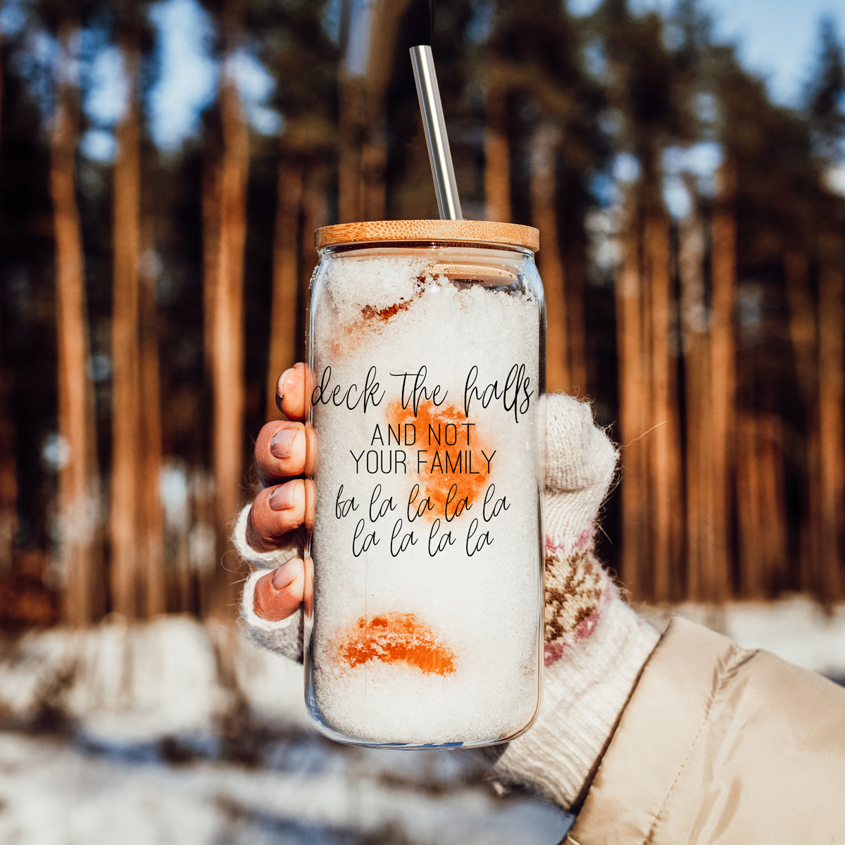 Deck the Halls 17oz Gia Roma glass tumbler with wooden lid and stainless straw in snowy forest on Tampa Home & Garden Store