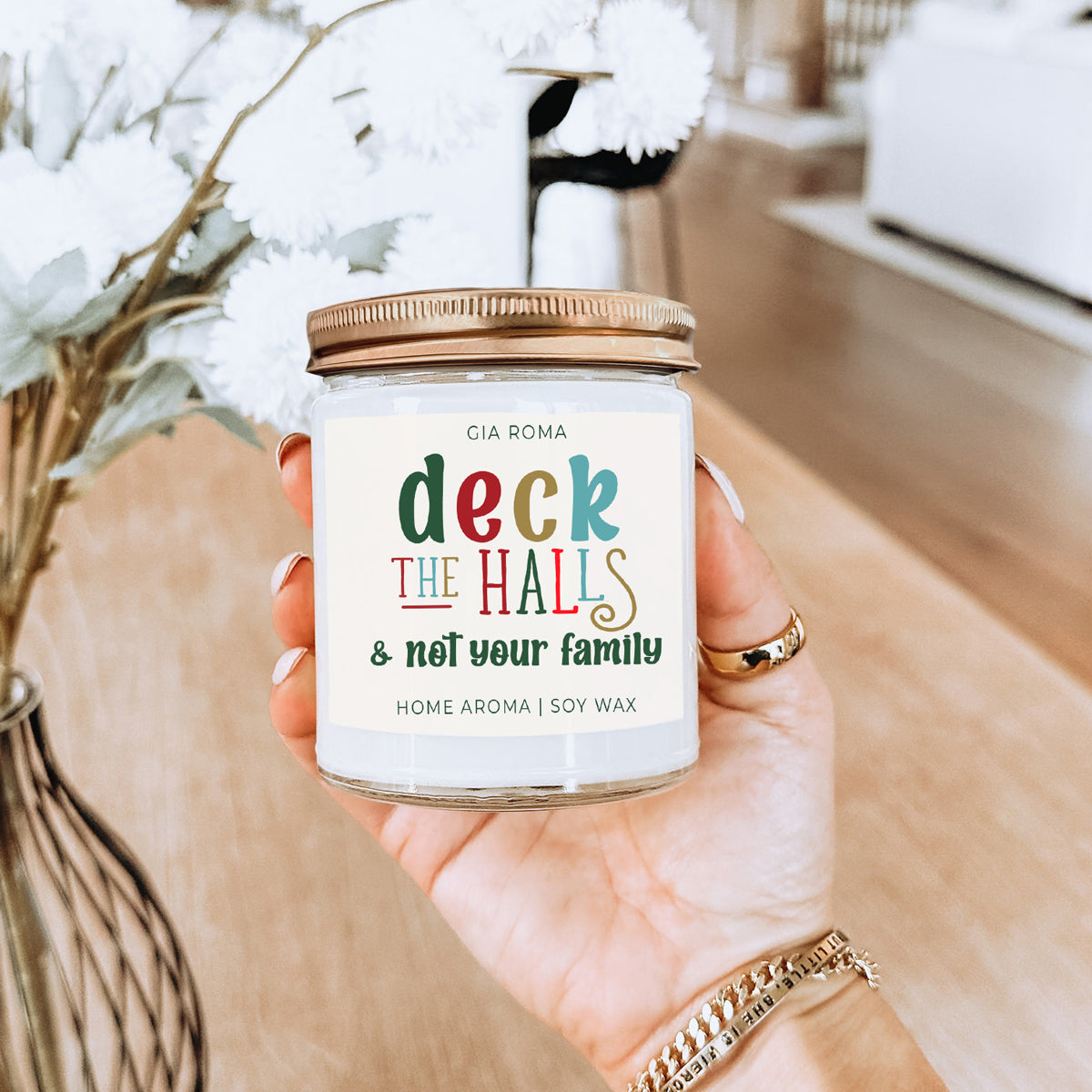 Deck The Halls Candle by Gia Roma in a clear glass jar with copper lid, colorful label, soy wax on Tampa Home & Garden Store