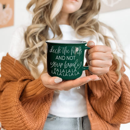 Deck The Halls coffee mug in dark green ceramic with holiday design on Tampa Home & Garden Store