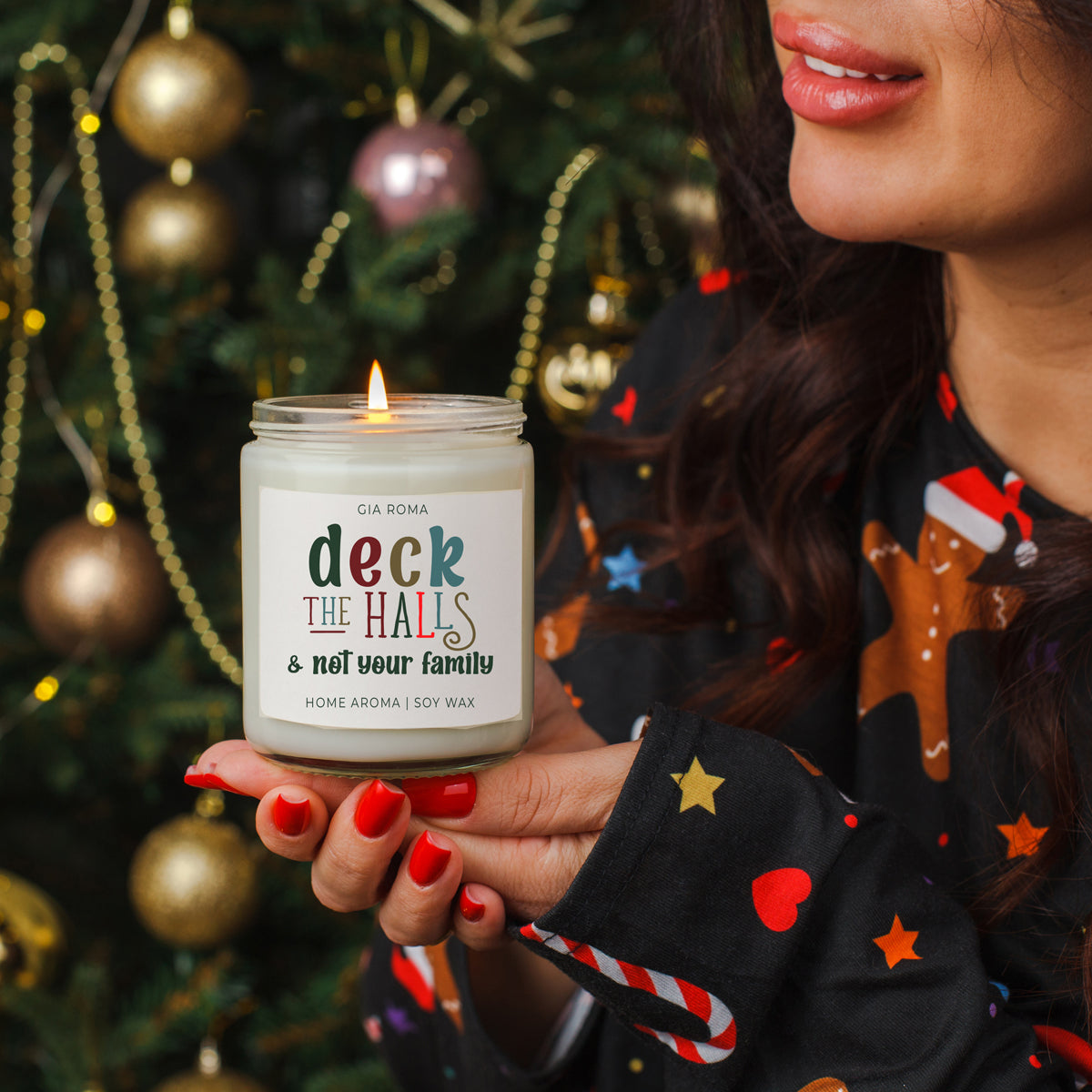 Deck The Halls Candle by Gia Roma, soy wax candle in a glass jar with a lit wick on Tampa Home & Garden Store