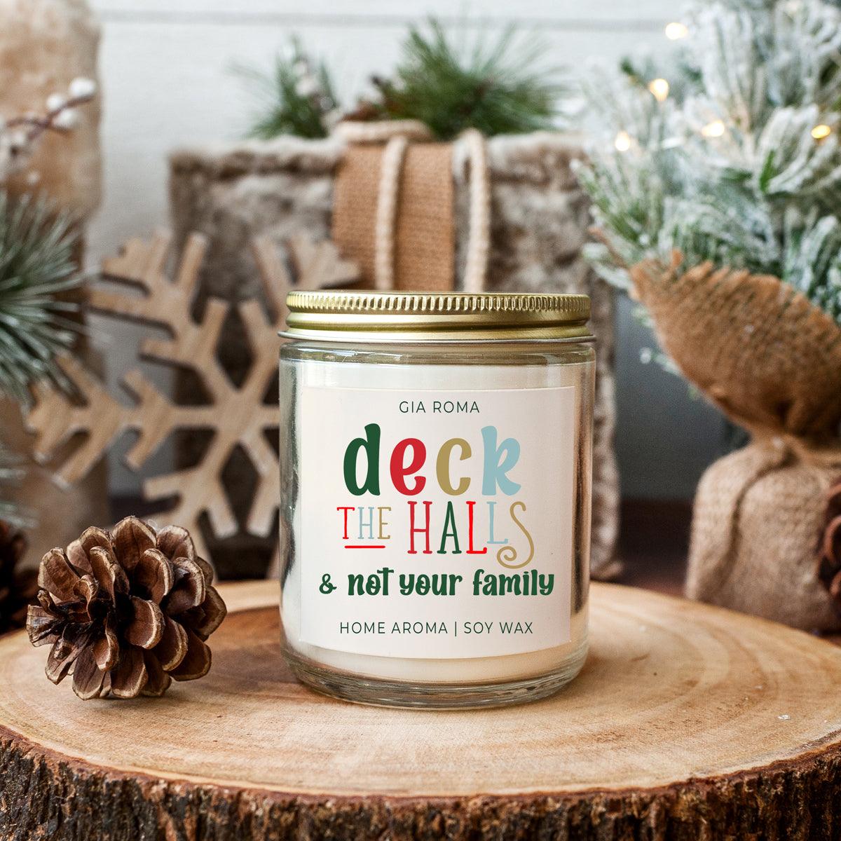 Deck The Halls candle by Gia Roma in a glass jar with a gold lid, colorful label, soy wax on Tampa Home & Garden Store