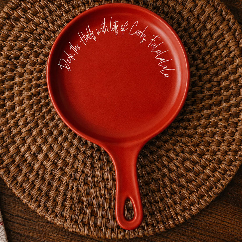 Deck the Halls & Carbs spoon rest by Gia Roma, red ceramic with white script around rim on Tampa Home & Garden Store