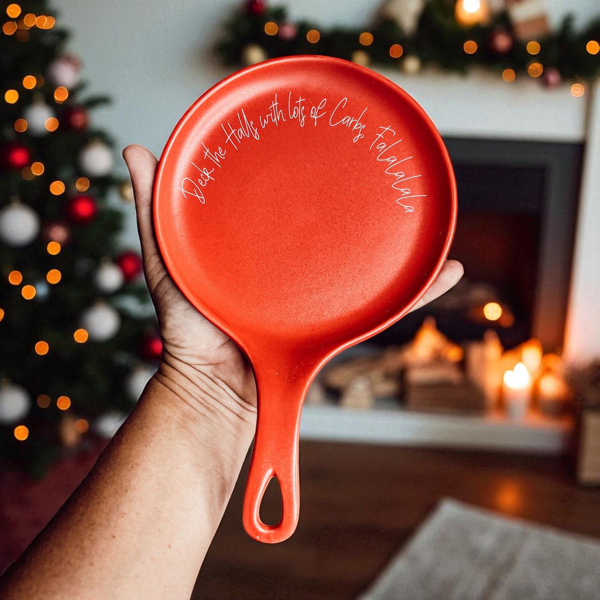 Red round spoon rest by Gia Roma with festive white script text Deck the Halls & Carbs on Tampa Home & Garden Store