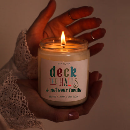 Deck The Halls candle by Gia Roma in a white glass jar with lit wick, soy wax on Tampa Home & Garden Store