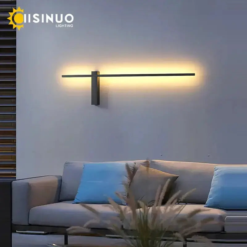 Minimalist black aluminum outdoor wall sconce with horizontal bar porch light warm glow on Tampa Home & Garden Store
