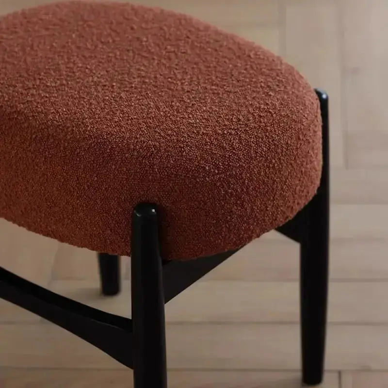 Mid-century makeup bench with gray ash wood legs and rust-brown boucle seat on Tampa Home & Garden Store