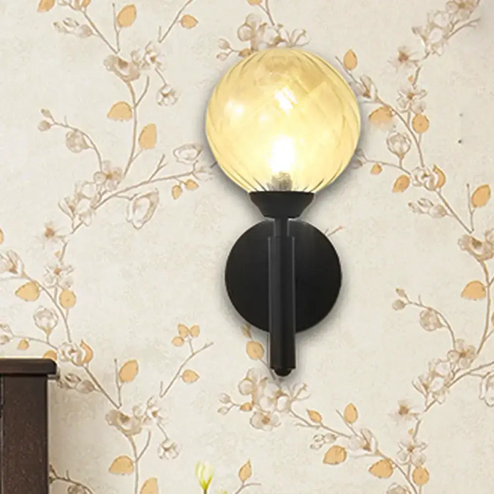 Black Textured Glass Sconce with amber globe on black round backplate, 1 count on Tampa Home & Garden Store