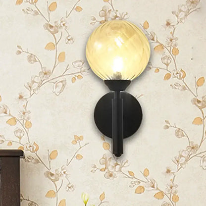 Black Textured Glass Sconce with amber globe on black round backplate, 1 count on Tampa Home & Garden Store