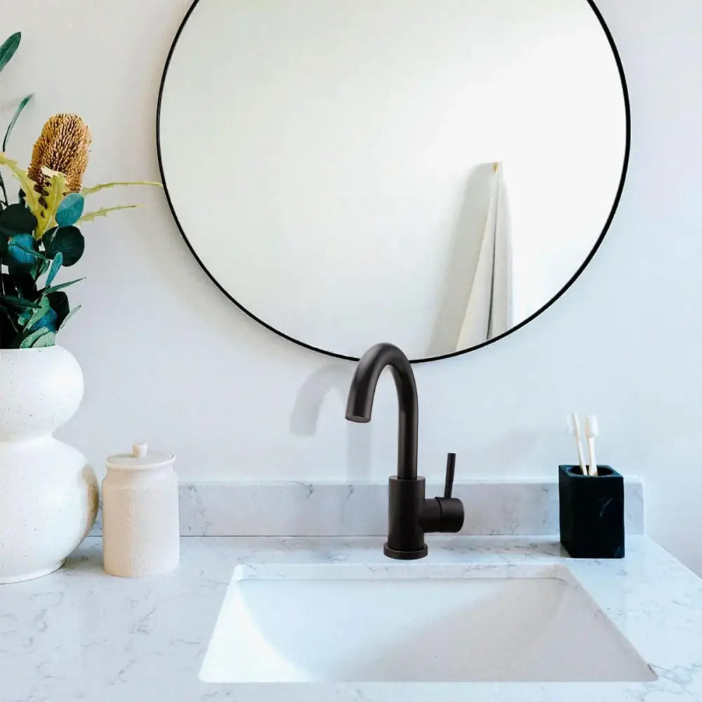 Black stainless kitchen faucet by Decorbites with matte black finish on white marble bathroom sink on Tampa Home & Garden Store