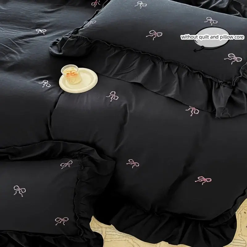 Black duvet cover set with pink bow embroidery and ruffled edges on Tampa Home & Garden Store