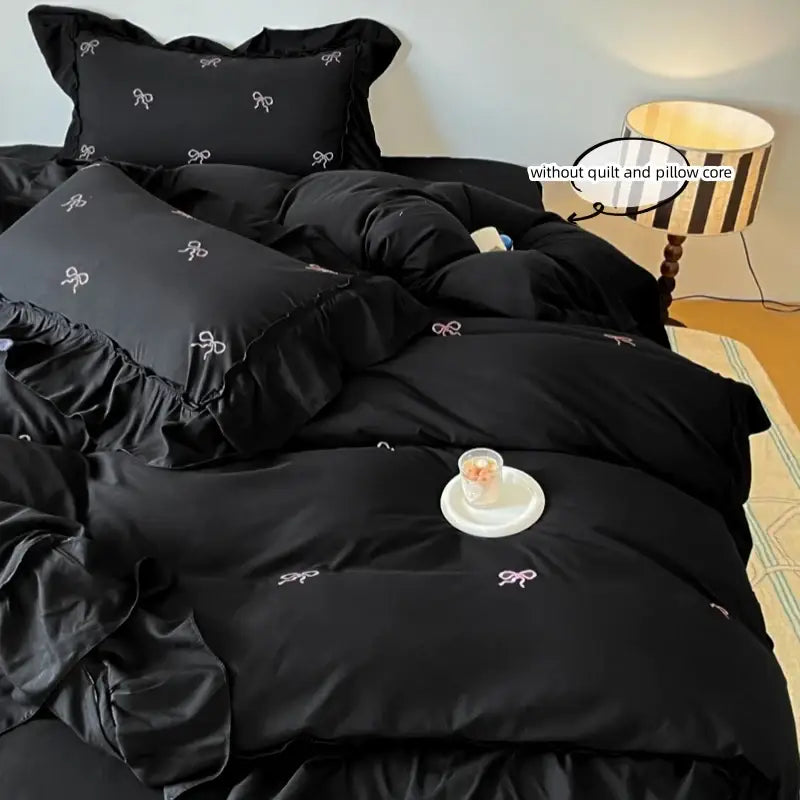 Decorbites black bow-embroidered duvet set with pillow shams and ruffled edges on Tampa Home & Garden Store