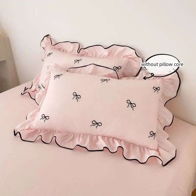 Duvet cover set with pink bow embroidery, 2 pillow shams, ruffled edges and black piping on Tampa Home & Garden Store