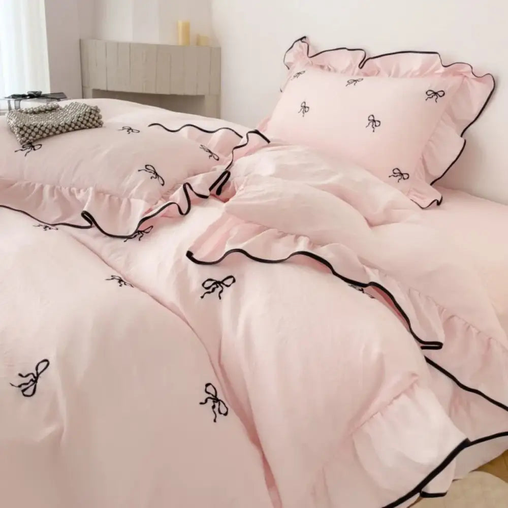 Decorbites pink duvet cover set with black bow embroidery and ruffled edges; includes two shams on Tampa Home & Garden Store