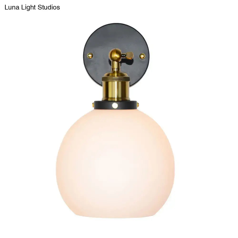 Brass bubble glass sconce by Decorbites with frosted globe on Tampa Home & Garden Store