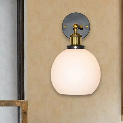 Brass bubble glass sconce wall mounted by Decorbites with frosted glass globe on Tampa Home & Garden Store