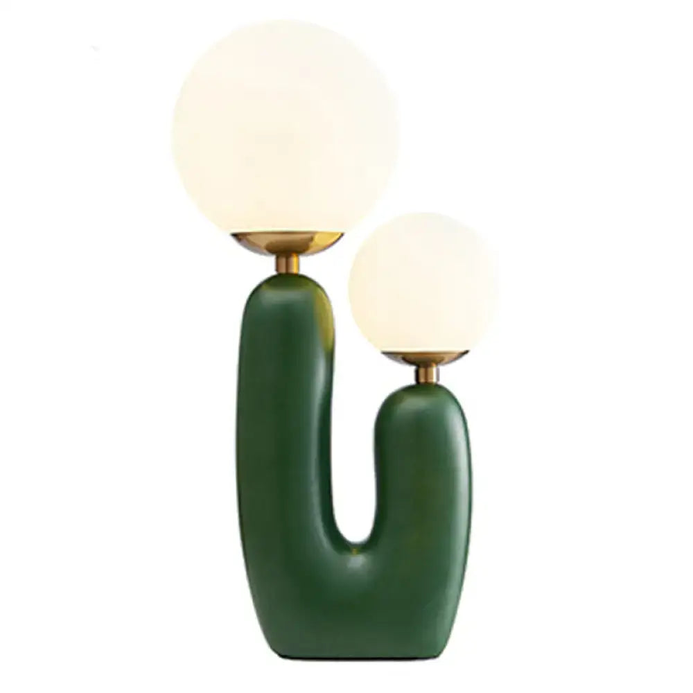 Green ceramic U-shaped bedside lamp with twin frosted globe shades by Decorbites on Tampa Home & Garden Store