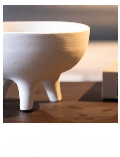 White ceramic tripod planter by Decorbites with three legs on Tampa Home & Garden Store