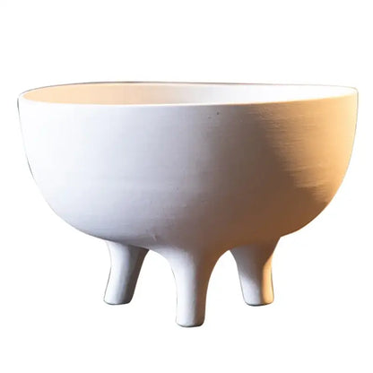 White ceramic tripod planter with a smooth rounded bowl and three short legs on Tampa Home & Garden Store