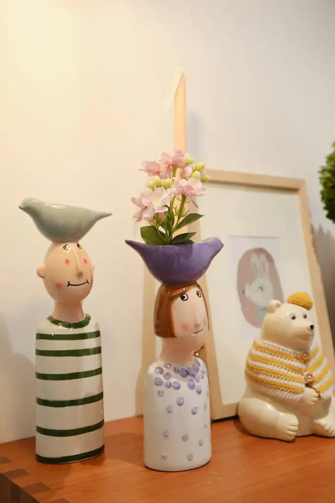 Blue ceramic vase set by Decorbites; two head-vase figurines with green and purple bowls on Tampa Home & Garden Store
