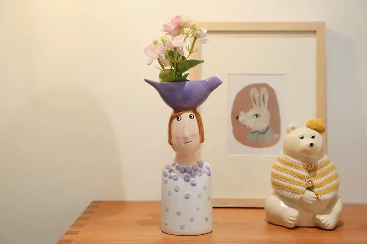 Blue ceramic vase set by Decorbites with purple planter bowl and pink flowers, bear figurine on Tampa Home & Garden Store