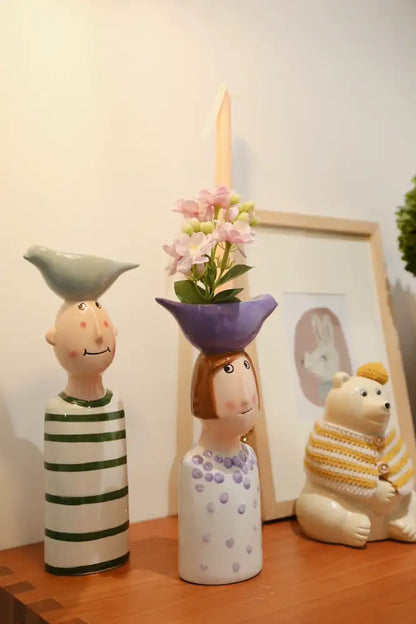 Blue ceramic vase set of 3 by Decorbites: whimsical figurine vases with flowers on a shelf on Tampa Home & Garden Store