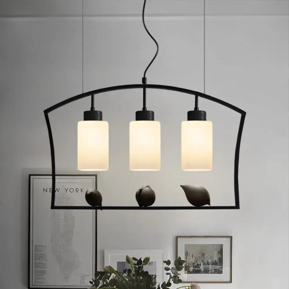 Black Cylinder Island Light pendant with three frosted glass cylinders attached to black frame on Tampa Home & Garden Store