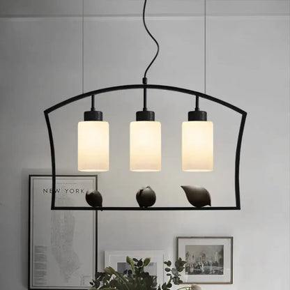 Black Cylinder Island Light pendant with three frosted glass cylinders attached to black frame on Tampa Home & Garden Store