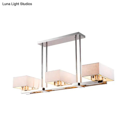 Pendant light Decorbites modern chrome finish with three rectangular white fabric shades on Tampa Home & Garden Store