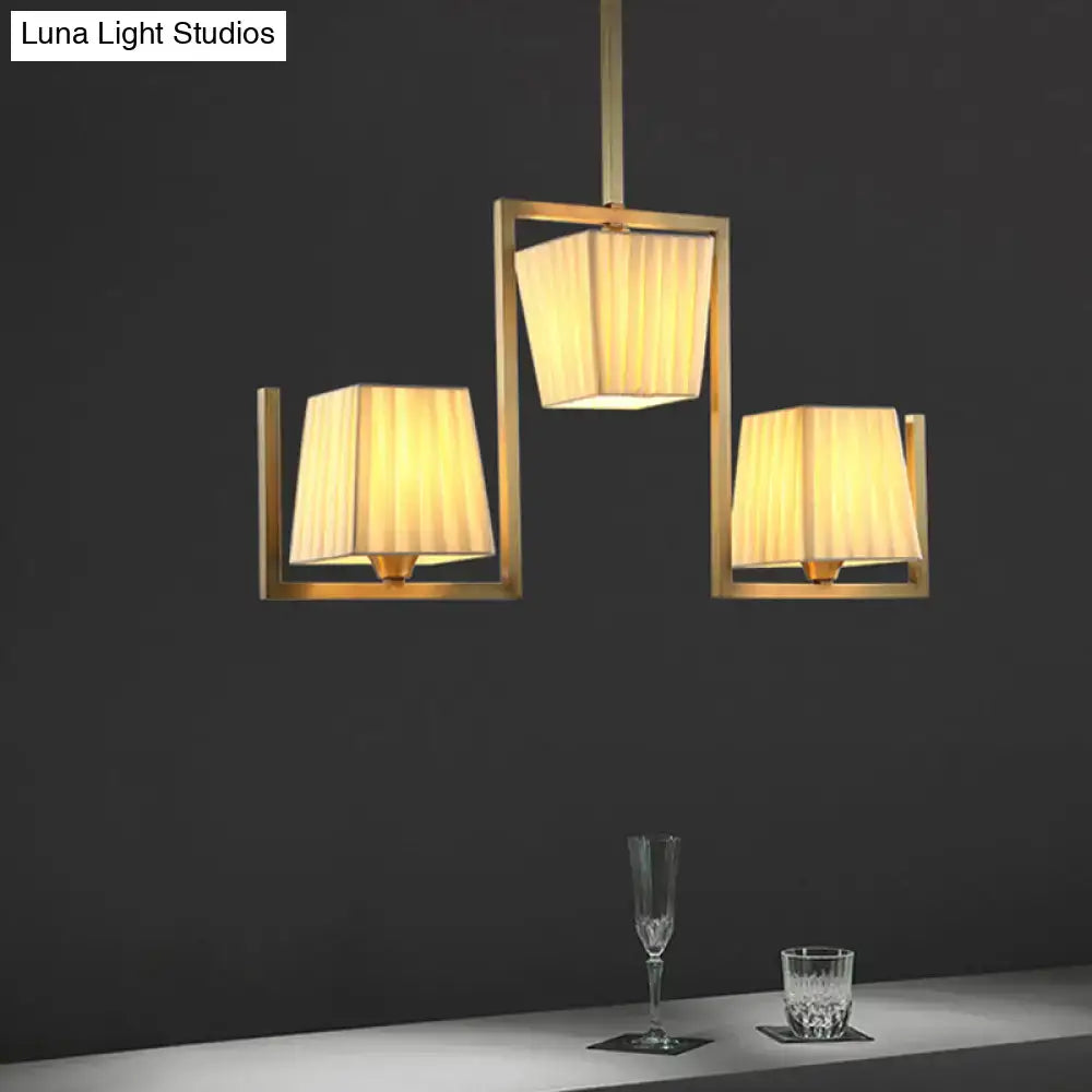 Decorbites brass flush mount ceiling light with three square frames and cream shades on Tampa Home & Garden Store