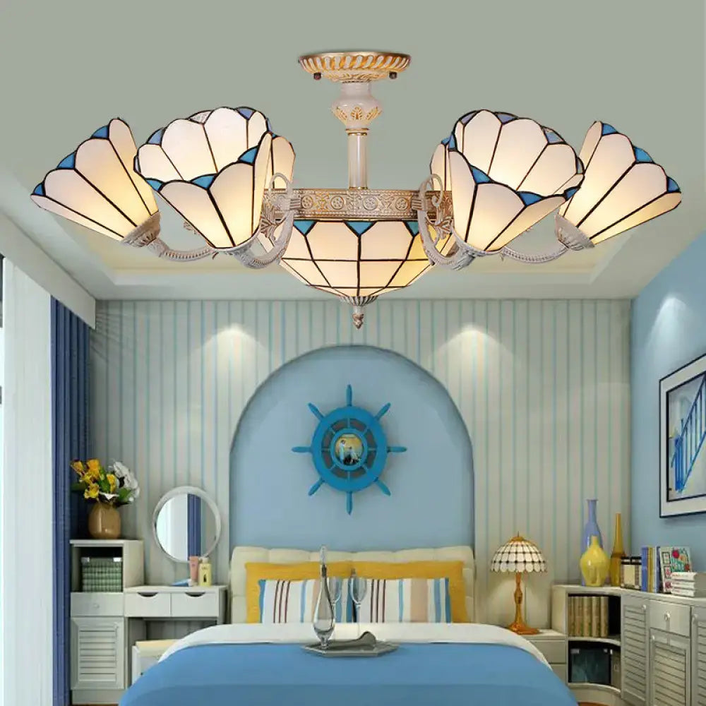 Cream blue glass chandelier by Decorbites with flower-shaped cream shades and antique gold frame on Tampa Home & Garden Store