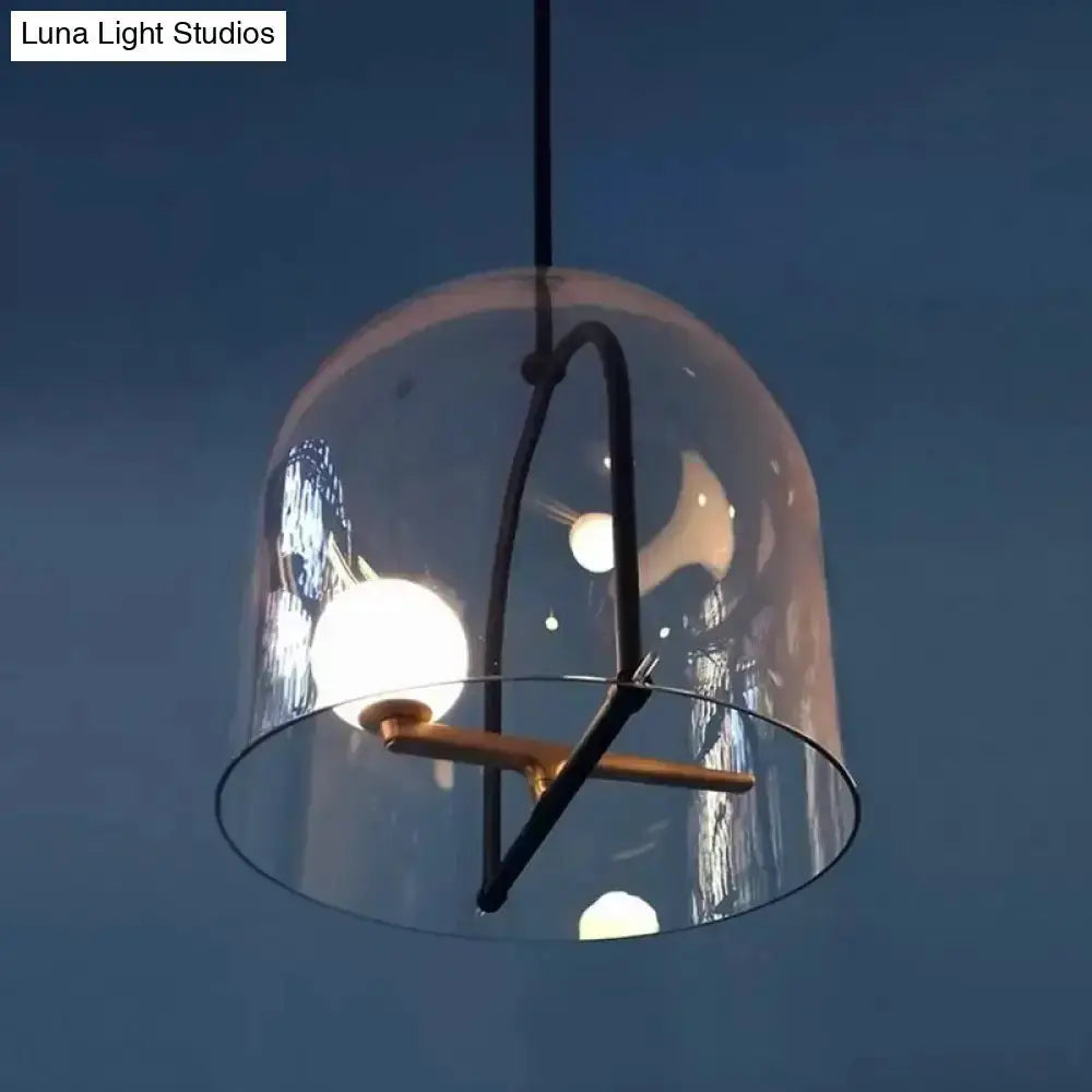 Modern clear glass cylinder pendant light with black frame and wooden crossbar for living room on Tampa Home & Garden Store