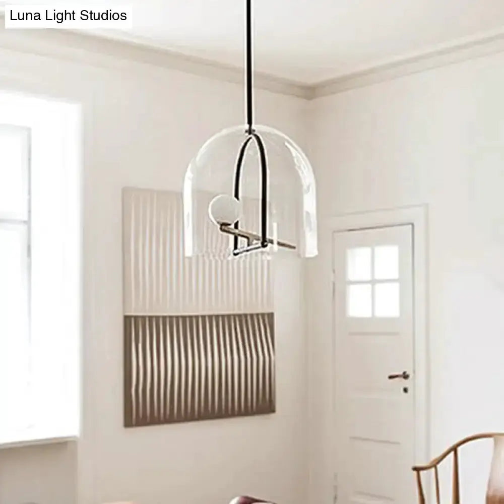 Modern clear glass cylinder pendant light with black frame for living room on Tampa Home & Garden Store
